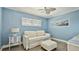 Living room featuring a white sofa, matching ottoman and plenty of light at 1257 S Portofino Dr # 306, Sarasota, FL 34242