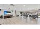 Spacious common room featuring hard-surface floors, modern décor, and multiple seating areas at 1257 S Portofino Dr # 306, Sarasota, FL 34242