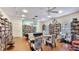 Community room offers a pool table, seating, and books, creating a comfortable space for relaxation and socializing at 1257 S Portofino Dr # 306, Sarasota, FL 34242