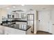 Well-lit kitchen with white cabinetry, stainless steel appliances, and granite countertops at 1257 S Portofino Dr # 306, Sarasota, FL 34242