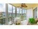 Enclosed lanai features an outdoor dining set and views of the water at 1257 S Portofino Dr # 306, Sarasota, FL 34242