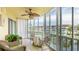 Enclosed lanai features an outdoor dining set and views of the water at 1257 S Portofino Dr # 306, Sarasota, FL 34242
