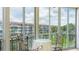 Enclosed lanai features an outdoor dining set and views of the water at 1257 S Portofino Dr # 306, Sarasota, FL 34242