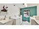 Bright laundry room with white appliances, sink, and storage, creating a functional and organized space for laundry tasks at 1257 S Portofino Dr # 306, Sarasota, FL 34242