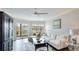 Bright living room with comfortable seating, a balcony, and stylish decor at 1257 S Portofino Dr # 306, Sarasota, FL 34242