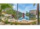 Beautiful waterfront view with boat dockage and picnic area on the water with lovely landscaping and tropical foliage at 1257 S Portofino Dr # 306, Sarasota, FL 34242