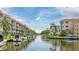 Picturesque waterfront community featuring residential buildings with boat docks along a scenic canal at 1257 S Portofino Dr # 306, Sarasota, FL 34242