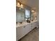 Bright bathroom features a dual vanity with white countertops and modern fixtures at 14312 Crimson Ave, Bradenton, FL 34211