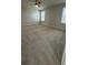 Spacious bedroom with neutral carpet, two windows, and ample natural light at 14312 Crimson Ave, Bradenton, FL 34211