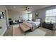 Spacious bedroom featuring a seating area, ceiling fan, and lots of natural light at 14312 Crimson Ave, Bradenton, FL 34211