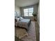 Bright bedroom features a neutral palette and ample natural light at 14312 Crimson Ave, Bradenton, FL 34211