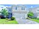 Charming two-story home with a paved driveway and a well-manicured front yard at 14312 Crimson Ave, Bradenton, FL 34211