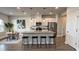 Modern kitchen featuring an island with seating, stainless steel appliances, and ample counter space at 14312 Crimson Ave, Bradenton, FL 34211