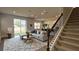 Bright living room with large sectional sofa, stylish rug, and sliding glass doors to outdoor space at 14312 Crimson Ave, Bradenton, FL 34211