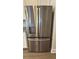 Close up of a modern, stainless steel refrigerator with water and ice dispenser built into the door at 14312 Crimson Ave, Bradenton, FL 34211
