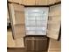 Interior view of stainless steel refrigerator featuring adjustable shelves and storage compartments inside at 14312 Crimson Ave, Bradenton, FL 34211