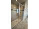 Tiled shower with glass enclosure, built-in seat, and decorative accent tile at 14312 Crimson Ave, Bradenton, FL 34211