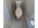 A small space featuring a modern toilet with a neutral-toned tile floor at 14312 Crimson Ave, Bradenton, FL 34211