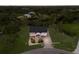 Aerial shot of a stilt home surrounded by green landscape at 1610 Bayshore Dr, Terra Ceia, FL 34250