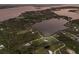 Overhead shot of a stunning property by the lake with beautiful natural surroundings at 1610 Bayshore Dr, Terra Ceia, FL 34250