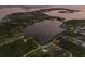Beautiful aerial view of a property with waterfront access and lush green landscaping at 1610 Bayshore Dr, Terra Ceia, FL 34250