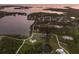 Aerial view of homes near a waterfront with mangrove islands at 1610 Bayshore Dr, Terra Ceia, FL 34250