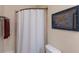 Bathroom with shower, toilet and towel rack at 1610 Bayshore Dr, Terra Ceia, FL 34250