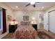 Cozy bedroom with hardwood floors, and adjacent doorway leading to another room at 1610 Bayshore Dr, Terra Ceia, FL 34250