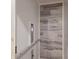 Residential elevator featuring marble-look tile accent wall and accessible handrails at 1610 Bayshore Dr, Terra Ceia, FL 34250