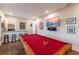 Game room with a pool table, wet bar, and wall-mounted TV is perfect for hosting friends and Gathering at 1610 Bayshore Dr, Terra Ceia, FL 34250
