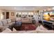 A generous sized living area features lots of seating, natural light, and a marble entertainment center at 1610 Bayshore Dr, Terra Ceia, FL 34250