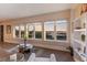 Bright living room featuring large windows with waterway views, light walls, and hardwood floors at 1610 Bayshore Dr, Terra Ceia, FL 34250