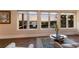Bright living room boasts beautiful water views and a stylish glass coffee table at 1610 Bayshore Dr, Terra Ceia, FL 34250
