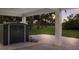 Backyard shed with gravel ground cover and view of the surrounding landscape at 1610 Bayshore Dr, Terra Ceia, FL 34250