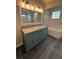 This renovated bathroom features a double sink vanity and a separate tub at 185 Wood Dove Ave, Tarpon Springs, FL 34689