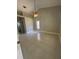 Spacious bedroom with neutral walls, tile floors, and a ceiling fan at 185 Wood Dove Ave, Tarpon Springs, FL 34689