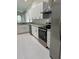 Stylish kitchen with white cabinets, stainless steel appliances, and granite countertops at 185 Wood Dove Ave, Tarpon Springs, FL 34689