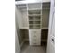 This walk-in closet has custom shelving with lots of functional storage space at 185 Wood Dove Ave, Tarpon Springs, FL 34689