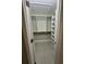 This walk-in closet has custom shelving with lots of functional storage space at 185 Wood Dove Ave, Tarpon Springs, FL 34689