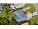 A bird's-eye view of the home with a pool, showcasing its layout and setting at 19897 Midway Blvd, Port Charlotte, FL 33948