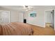 Cozy bedroom with wood floors, ceiling fan, and a flatscreen tv at 19897 Midway Blvd, Port Charlotte, FL 33948