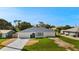 Charming single-story home with a well-manicured lawn and inviting curb appeal at 19897 Midway Blvd, Port Charlotte, FL 33948
