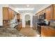 Well-lit kitchen boasts wood cabinets, stainless appliances, and an open layout at 19897 Midway Blvd, Port Charlotte, FL 33948
