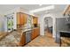 Kitchen features wood cabinets, granite countertops, and stainless steel dishwasher at 19897 Midway Blvd, Port Charlotte, FL 33948