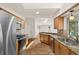 Spacious kitchen featuring wood cabinets, granite counters, and stainless appliances at 19897 Midway Blvd, Port Charlotte, FL 33948