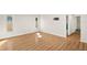 Bright living room with sleek wood floors, abundant natural light, and modern wall mount at 19897 Midway Blvd, Port Charlotte, FL 33948