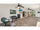 Large patio with stone floors, TV, and outdoor cooking area, perfect for entertaining at 19897 Midway Blvd, Port Charlotte, FL 33948