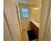 Well-lit bathroom with double sink vanity, tile floor, and a large mirror, perfect for a Gathering at 20940 Valore Ct, Venice, FL 34293
