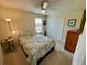 Cozy bedroom with a double closet, a large window, and classic decor at 20940 Valore Ct, Venice, FL 34293