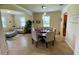 Charming dining area with an open concept design, seamlessly connecting the living room and kitchen at 20940 Valore Ct, Venice, FL 34293